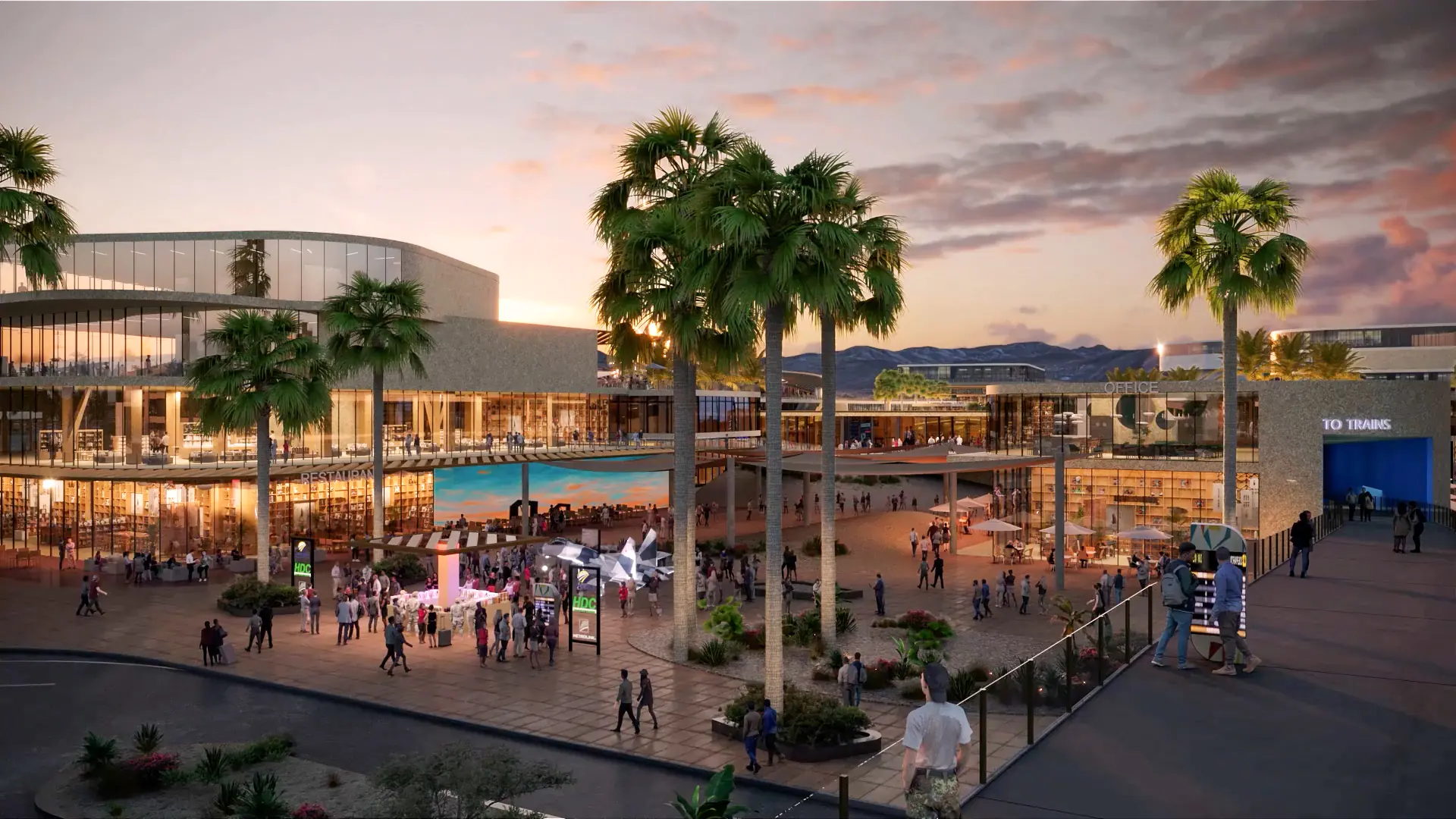 Close-up rendering of the Palmdale high-speed rail station plaza with many pedestrians, with an office building on the right providing access to the trains